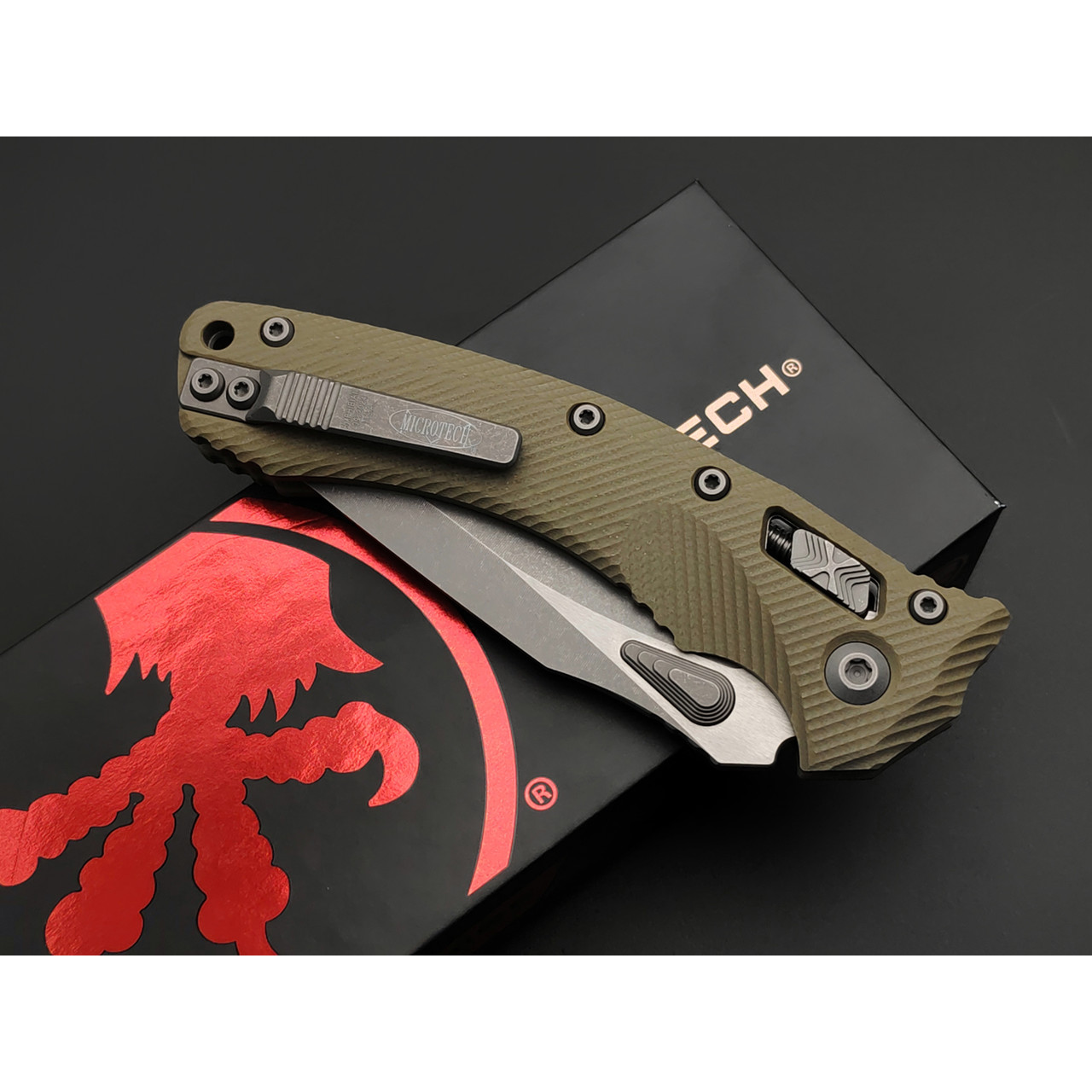 Нож Microtech Amphibian Ram-Lok serrated 137RL-11APFLGTOD сталь M390MK apocalyptic стоунвош, рукоять G10 olive