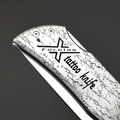 X Тату нож складной Модель X2 "Король Азарта", сталь Aus10Co, рукоять AISI420 с гравировкой X Тату нож складной Модель X2 "Король Азарта", сталь Aus10Co, рукоять AISI420 с гравировкой